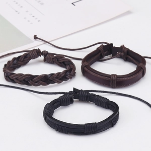 Macro view of three vintage braided leather bracelets with adjustable pull strings