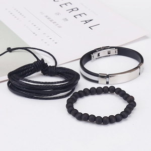 Detailed view of three-piece men's bracelet set with braided leather and matte beads