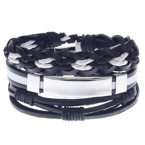 Detail showing multilayer braided leather bracelet with silver stainless steel plate