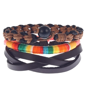 Detail view of a three-piece set with woven leather cords and rainbow thread wrap bracelet