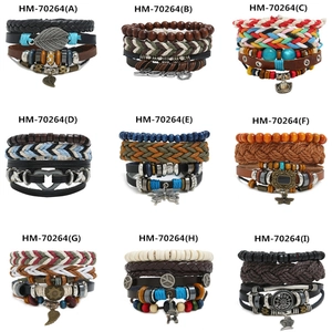 Detail showing multilayer braided leather bracelets with various charms and wooden beads