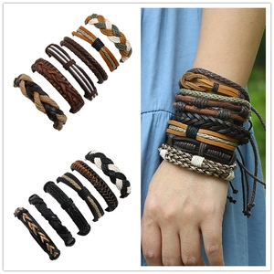 Detail of vintage braided leather bracelets set with adjustable cord for men
