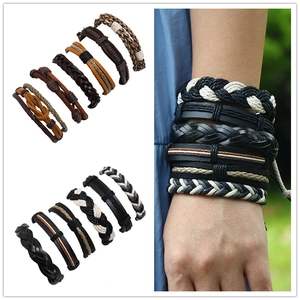 Close-up of vintage braided leather bracelet sets featuring mixed weaving and knot textures