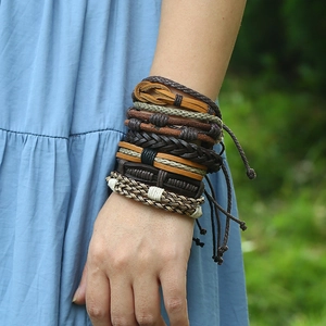 Detail of vintage multilayer braided leather bracelet set for men on a wrist