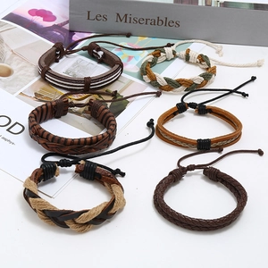 Set of six vintage braided leather bracelets in earth tones with adjustable cords