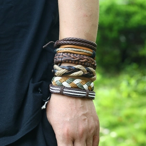 Detailed view of six-piece men's multilayer braided leather bracelet set with mixed textures