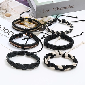 Detailed close-up of six-piece vintage woven leather bracelet set with adjustable cords