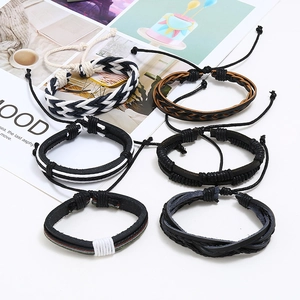 Detail of six-piece vintage leather bracelet set with woven texture and adjustable cords
