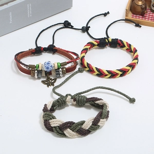Detailed set of multi-layer leather bracelets featuring a metal butterfly charm and beads