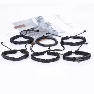 Retro black leather bracelet set for men featuring tree of life charms and woven beads