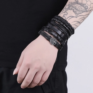 Detailed close-up of a 6-piece black leather bracelet set featuring the Tree of Life charm