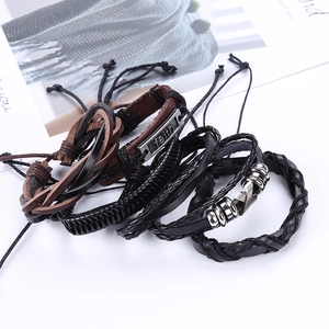Men's vintage braided leather bracelet set with faith metal plate on white background