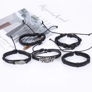 5-piece set of retro black leather bracelets featuring silver wing and star charms