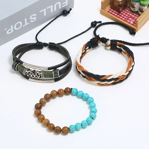 Close-up of multilayer braided leather bracelet set with turquoise beads and wood details