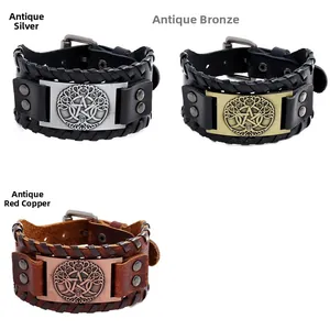 Detail of vintage braided leather bracelets in antique silver, bronze and red copper finish