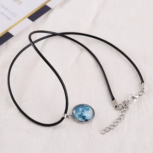 Luminous moon glow necklace with cosmic star glass pendant on adjustable black wax rope