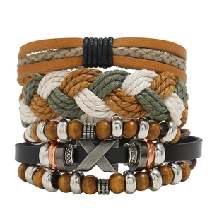 Detail of multi-layer braided leather bracelet with wooden beads and X-metal charm
