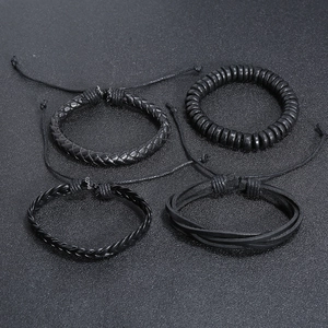 Set of four vintage black braided leather bracelets with adjustable wooden bead accents