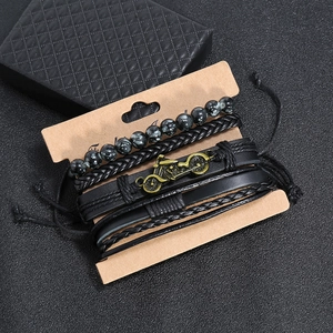 Men's retro layered leather bracelet set with motorcycle charm on a black textured background