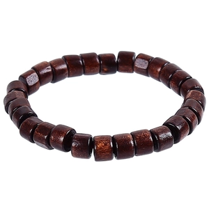 Ethnic style dark brown wooden bead bracelet with carved cylinder beads on white background