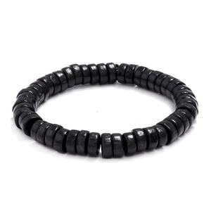 Detail of polished black rondelle wood beads on an elastic minimalist bracelet