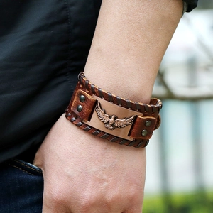 Bracciale intrecciato norreno vichingo in pelle da uomo con stemma aquila in bronzo