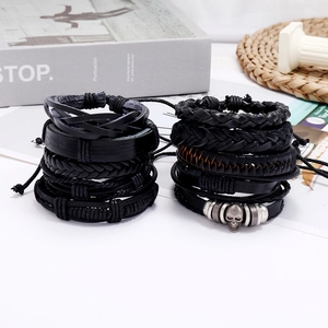 Men's vintage black layered leather bracelet set with skull charm and braided wax ropes