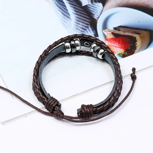 Detail of woven brown leather bracelet with silver beads on illustrated background