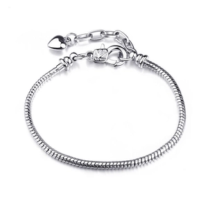 Polished silver snake chain bracelet with lobster clasp and heart charm detail