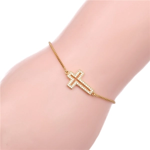 Adjustable gold cross bracelet for women with pavé cubic zirconia and a polished chain