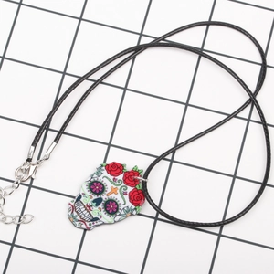 Acrylic Day of the Dead skull necklace with floral patterns and black cord chain