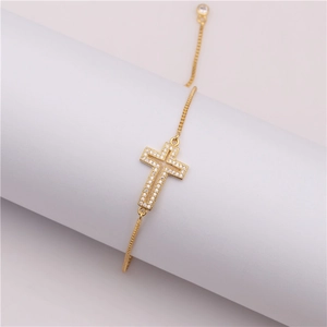 Adjustable gold cross bracelet with micro-paved zircons on a classic box chain