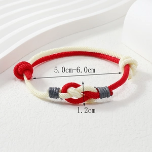 Detail showing the adjustable 1.2cm wide hand-woven red cord couple bracelet dimensions