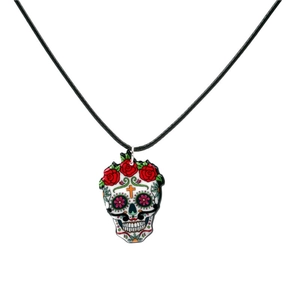 Detailed macro view of Day of the Dead acrylic skull pendant with colorful floral art