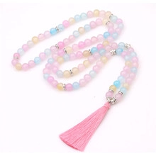 Detailed macro of macaron-colored beaded necklace with a soft silk tassel pendant