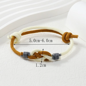 Detailed view of woven red string bracelet showing 1.2cm knot width and adjustable size