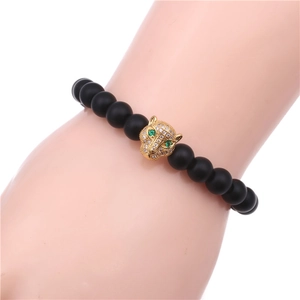 Detail of beaded bracelet featuring gold leopard head with micro-pave cubic zirconia