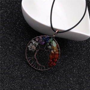 Detailed close-up of Tree of Life pendant with multicolored stones on black cord