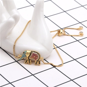 Detail view of gold elephant bracelet featuring colorful micro-pave zirconia and pull clasp