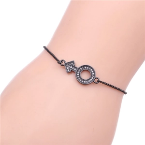 Detail of black male symbol bracelet with micro-paved white zircons and adjustable slider