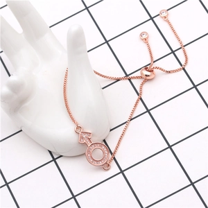 Detail of rose gold adjustable box chain bracelet with micro-pave zircon Mars symbol charm