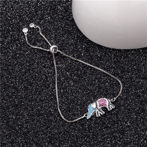 Detail of adjustable silver bracelet with micro-pave elephant pendant and colorful crystals