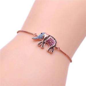 Detail of adjustable rose gold elephant bracelet with colorful pave crystals on wrist