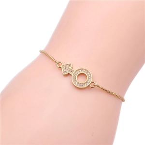 Detail of adjustable gold box chain bracelet with pave zircon male symbol charm