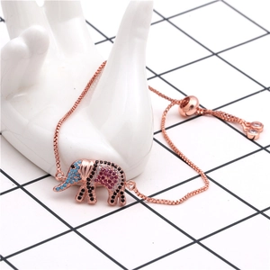 Detail of rose gold elephant bracelet with colorful pavé zircons on ceramic hand model