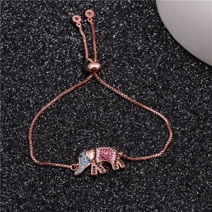 Detail of rose gold elephant bracelet with colorful gemstones and adjustable slider