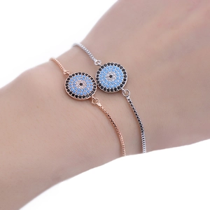 Macro shot of two adjustable evil eye bracelets with cubic zirconia in rose gold and silver