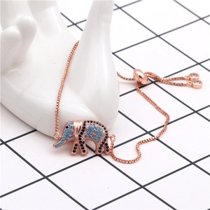 Detail of rose gold elephant bracelet with micro-paved blue and black zircons on hand mold