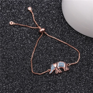 Detail of rose gold elephant charm bracelet with blue micro-pave crystals and box chain