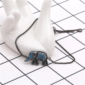 Close-up of elephant bracelet featuring blue zircon inlay and adjustable black metal chain